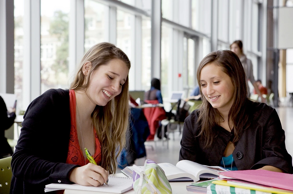 International students studying in a modern classroom setting in Quebec