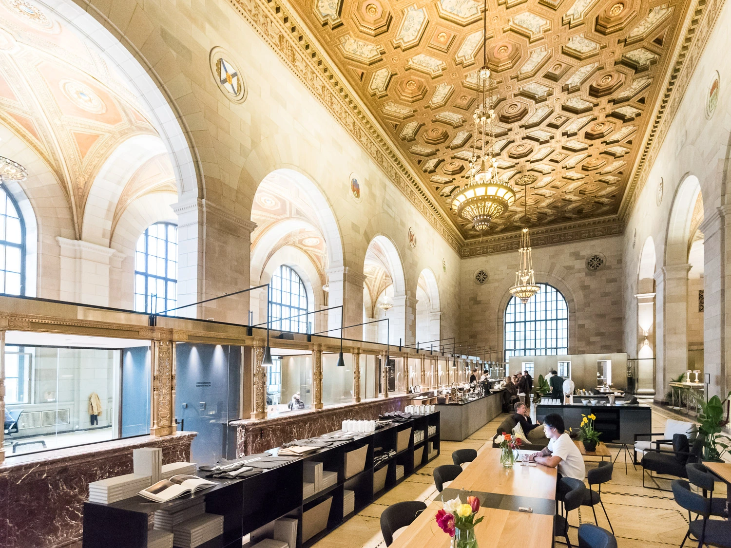 Grand interior of Crew Collective & Café, showcasing high ceilings, ornate details, and bustling activity